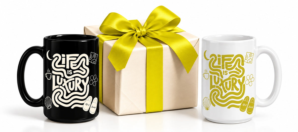 Two Life Is Luxury Sips beside a wrapped gift